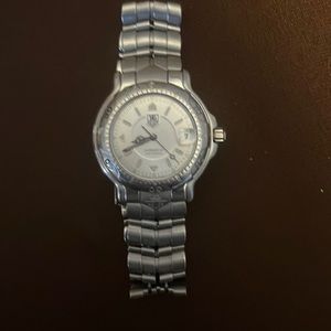 Tag Heuer watch, WH1113-K1 ab7115 is the serial numbers. Beautiful dress watch!